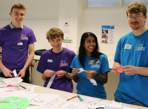 Demonstrators playing with the flexagons