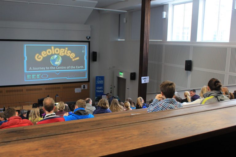 Children in a lecture hall listening to a talk at CBS
